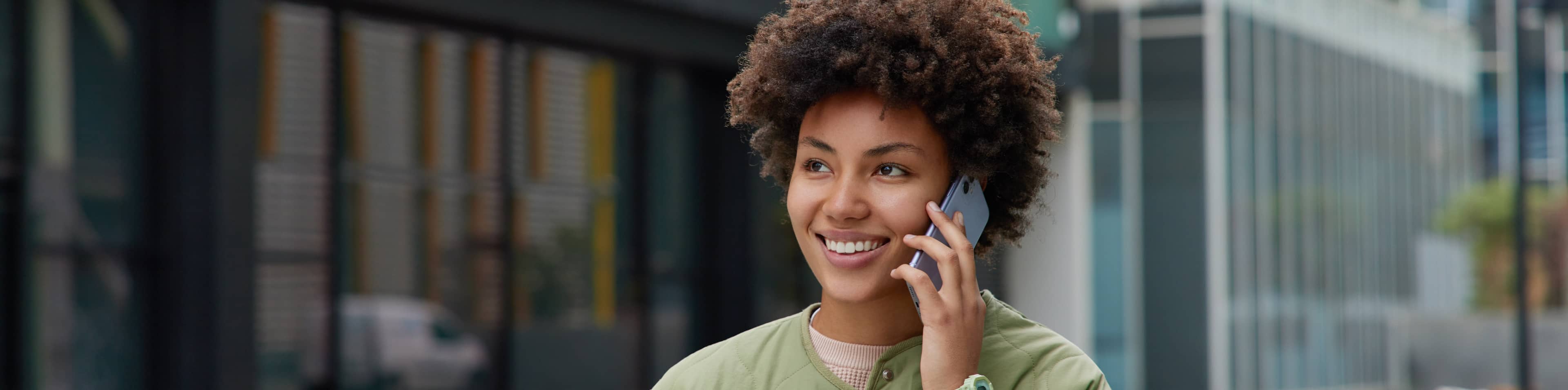 woman smiling on the phone
